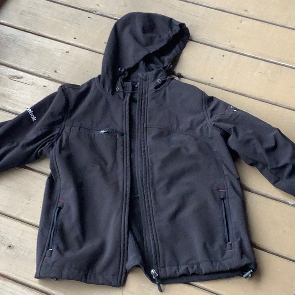 Women’s black Reebok Jacket with hood. Size medium
